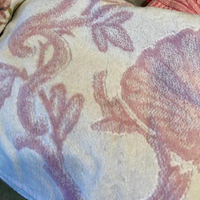 Pile of Patterned Pink Towels 