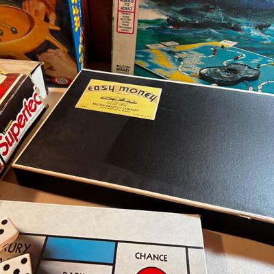 5 Board Games: Bermuda Triangle Monopoly, Perfection. Etc.