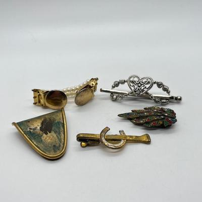 LOT 16: Five Assorted Clips