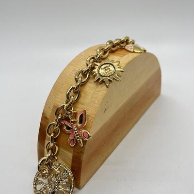 LOT 24: Three Goldtone Charm Bracelets