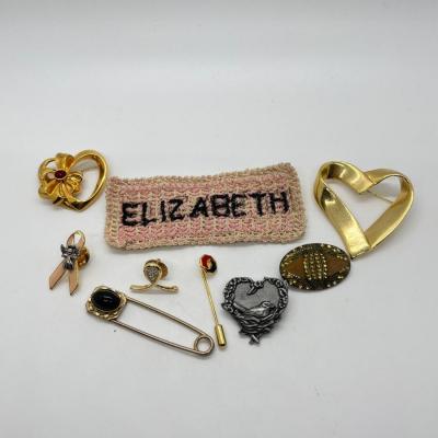 LOT 25: Nine Assorted Pins/Brooches