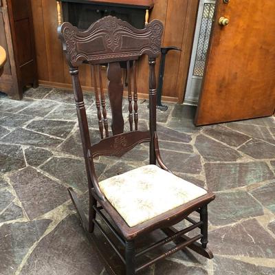 Antique carved wood armless rocker