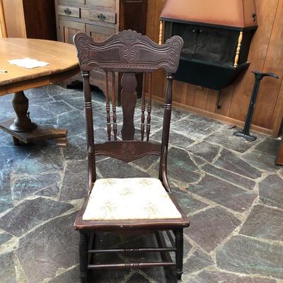 Antique carved wood armless rocker