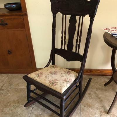 Antique carved wood armless rocker