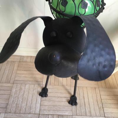 Metal dog sculpture with light up globe