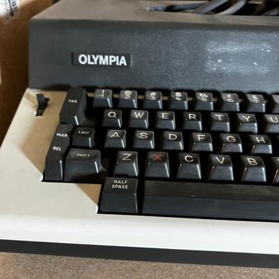 Olympia Report DE lux 