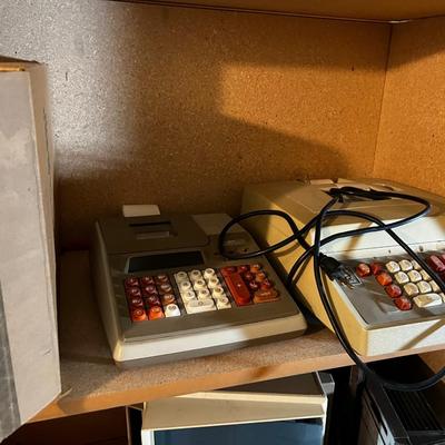 Shelf Full of old Electric Adding Machines; Victor 
