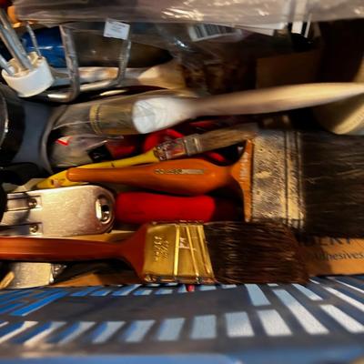 Painting supplies in a blue basket