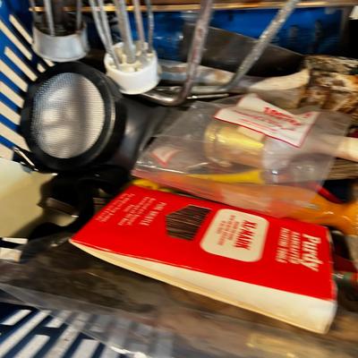 Painting supplies in a blue basket