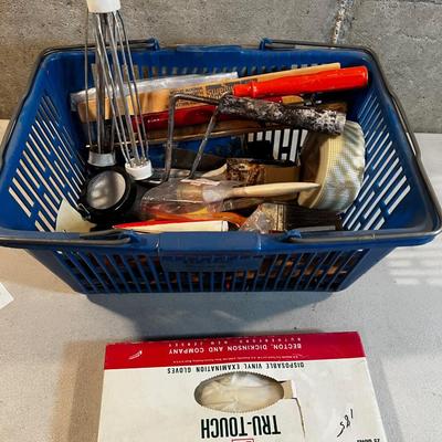 Painting supplies in a blue basket
