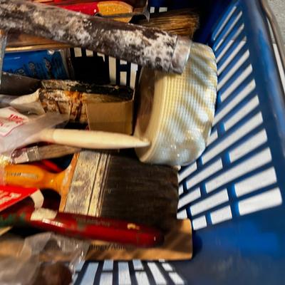 Painting supplies in a blue basket