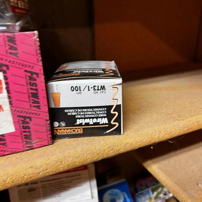 Shelf Full of Parts and bits: Sandpaper, Hardware, Screws etc.