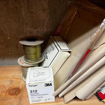 Shelf Full of Parts and bits: Sandpaper, Hardware, Screws etc.