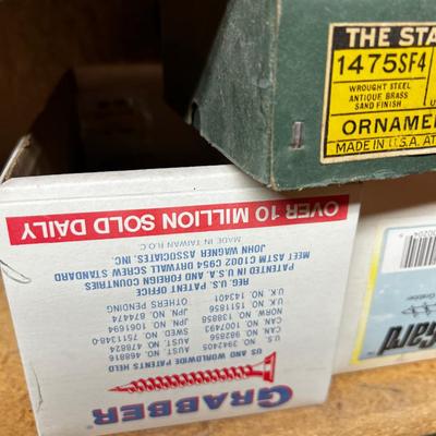 Shelf Full of Parts and bits: Sandpaper, Hardware, Screws etc.