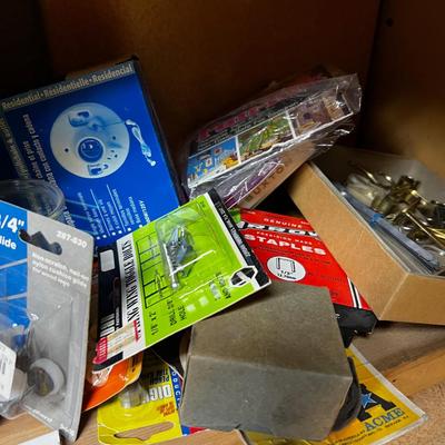 Shelf Full of Parts and bits: Sandpaper, Hardware, Screws etc.