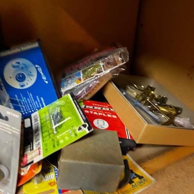 Shelf Full of Parts and bits: Sandpaper, Hardware, Screws etc.
