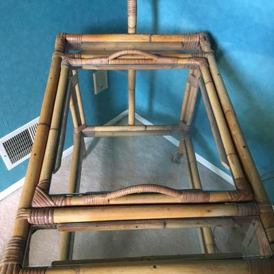 Vintage bamboo bar cart with wheels and removable tray.
