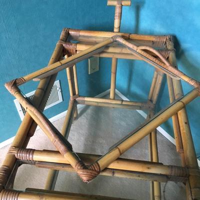 Vintage bamboo bar cart with wheels and removable tray.