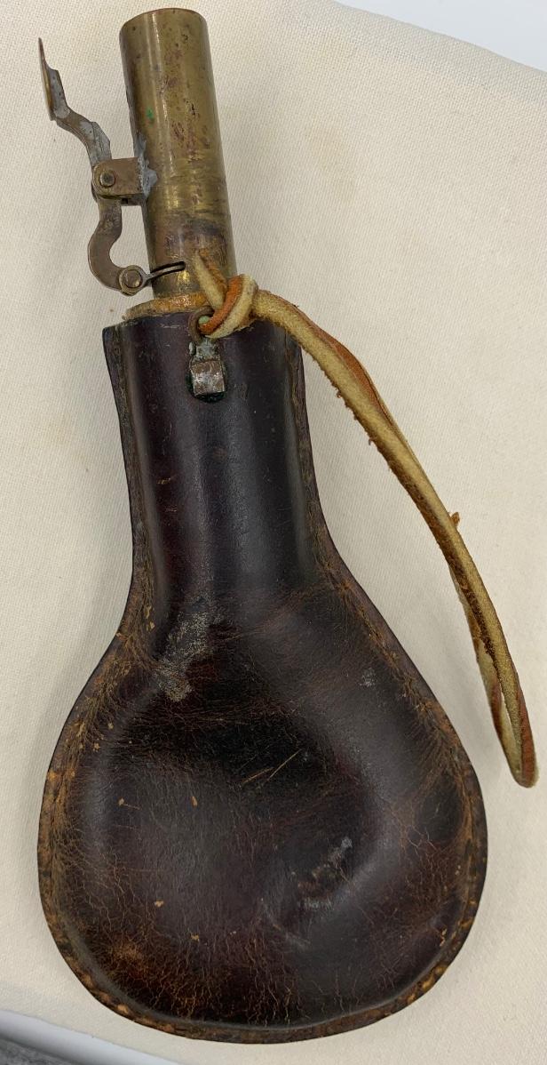 Antique leather birdshot pellet pouch with pellets inside