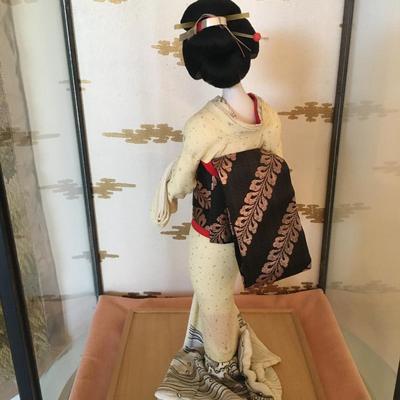 Geisha doll in glass case