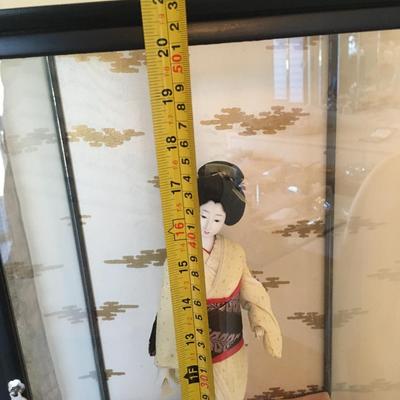 Geisha doll in glass case