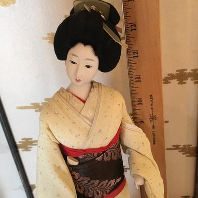 Geisha doll in glass case
