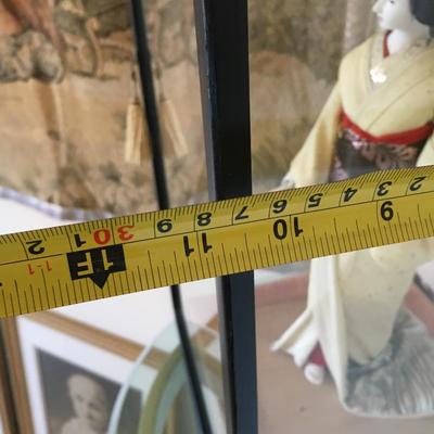 Geisha doll in glass case