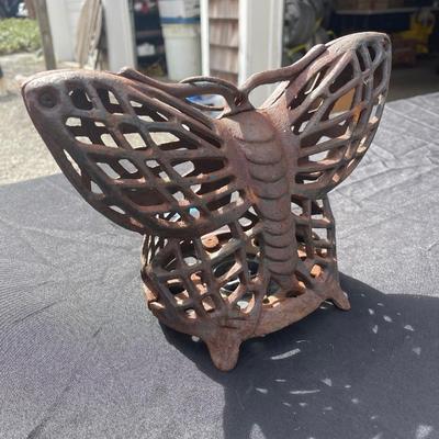 Lot 31 - Heavy cast iron butterfly candle holder