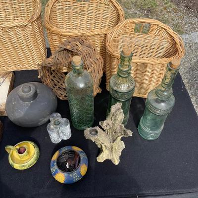Lot 33 - Baskets, glass bottles, resin wall plaques and more