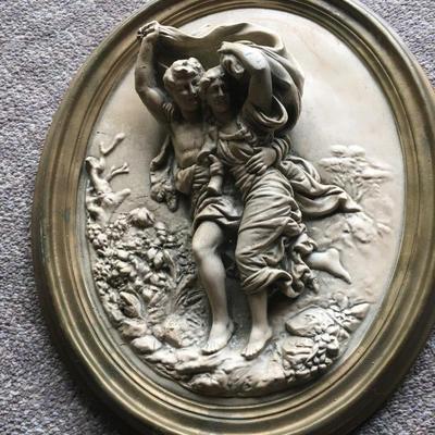 two Romantic chalkware Italian wall plaques