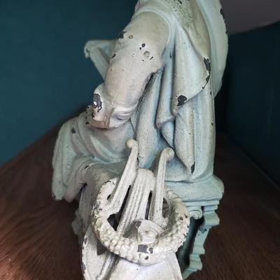 Cast iron man with books Lyre