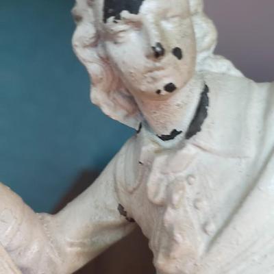 Cast iron man with books Lyre