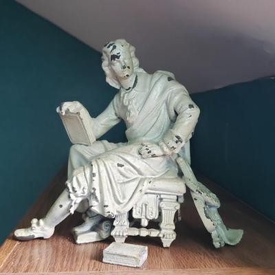 Cast iron man with books Lyre
