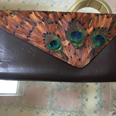 Vintage leather clutch with peacock feathers