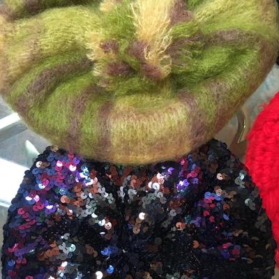 Knit berets some with pom poms
