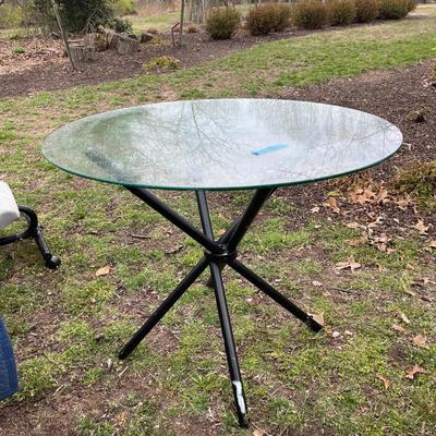 Lot 108 - Glass top table, with black foldable base