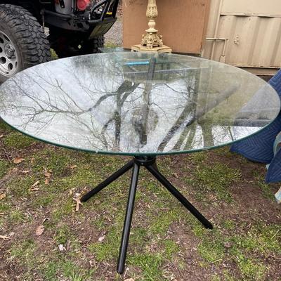 Lot 108 - Glass top table, with black foldable base
