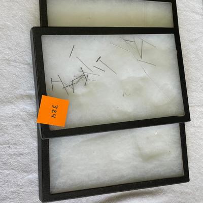 Glass Topped cotton filled display trays.