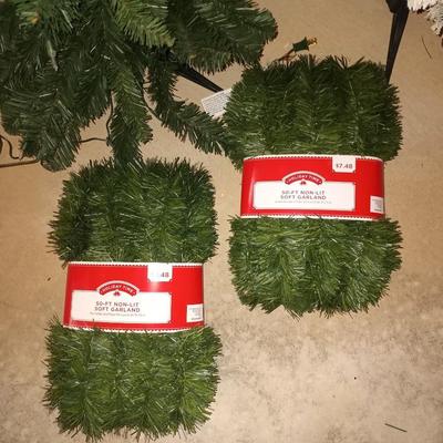 TWO 4' CHRISTMAS TREES AND TWO NEW 50' SOFT GARLAND