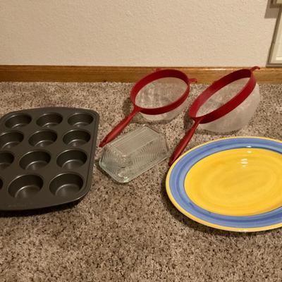 Cupcake pan, two strainers , platter and butter dish.