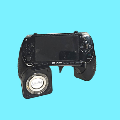 Playstation P2P Portalble Handheld Game System (used) w/ Datel Power Grips & 4 Games