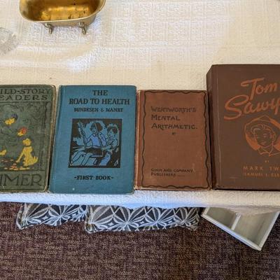 Collection of 4 Antique Books: Primer Reader, The Road to Health, Wentworth's Mental Arithmetic, Tom Sawyer