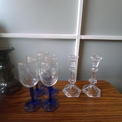 BLUE GLASS STEMMED DRINKING GLASSES AND CRYSTAL CANDLE HOLDERS