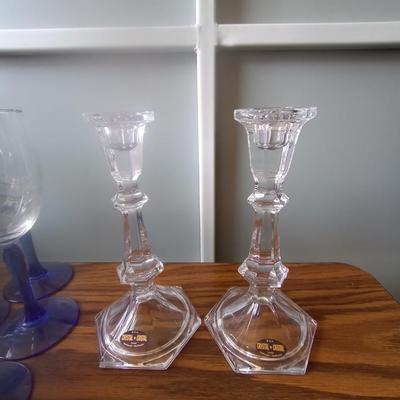 BLUE GLASS STEMMED DRINKING GLASSES AND CRYSTAL CANDLE HOLDERS