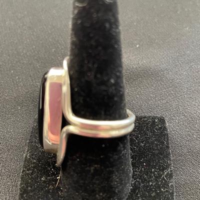 STERLING SILVER RING WITH AN OVAL BLACK STONE