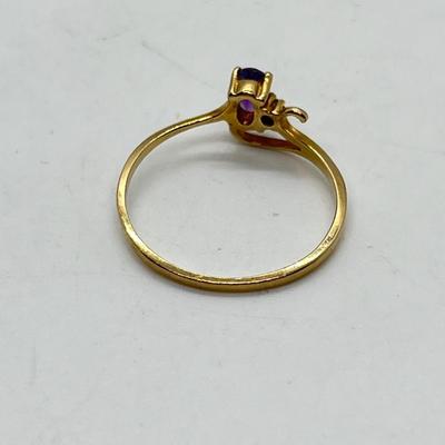 LOT 105: 10K Gold Magic Glo Amethyst Diamond Chip Size 7 Ring - 0.89 gtw