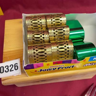 6 brass and 2 green napkin holder