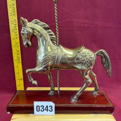 Brass carousel horse statue on base