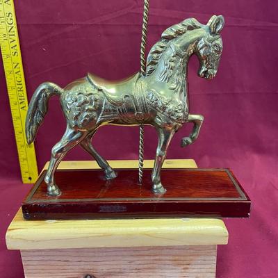 Brass carousel horse statue on base