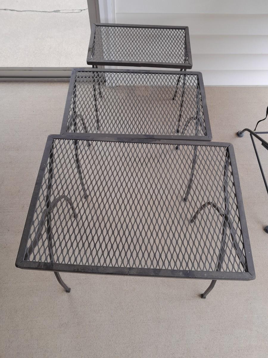 Three nesting metal mesh patio tables